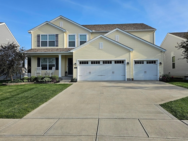 view of front facade featuring a front yard, an attached garage, covered porch, and driveway