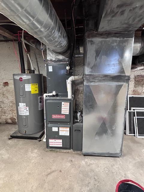 utility room featuring electric water heater