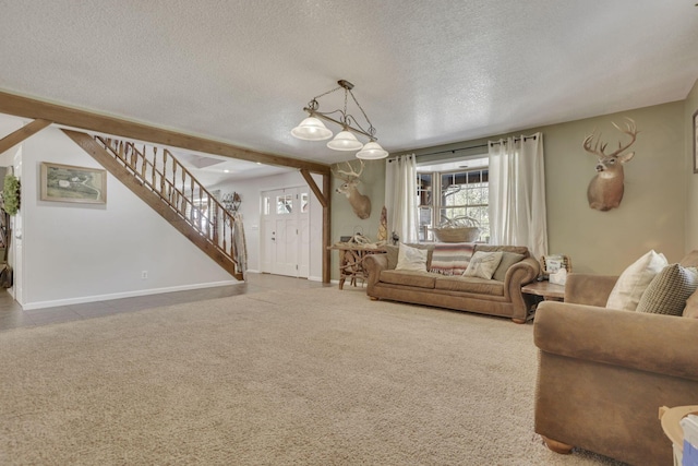 living area with stairs, baseboards, carpet floors, and a textured ceiling