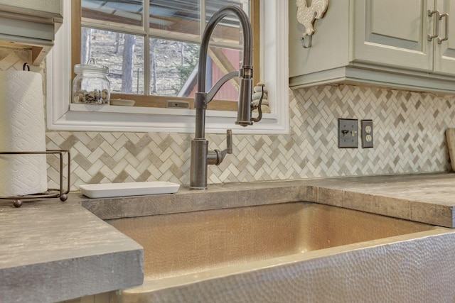 details featuring backsplash and a sink