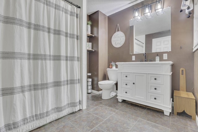 full bath with toilet, vanity, and baseboards