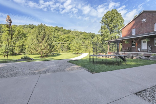 view of yard featuring a trampoline