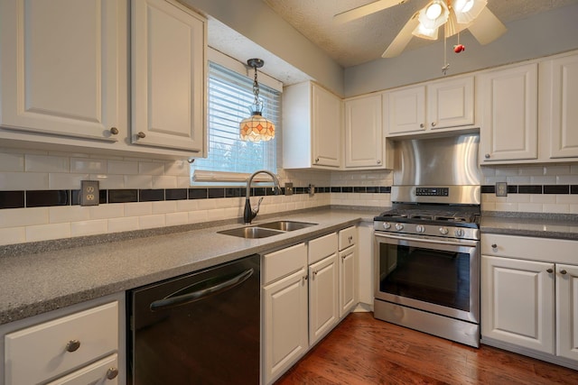 kitchen featuring dishwashing machine, wood finished floors, white cabinets, stainless steel gas range, and a sink