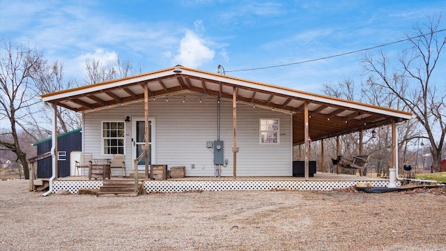 rear view of house with a wooden deck