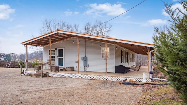 back of house with fence