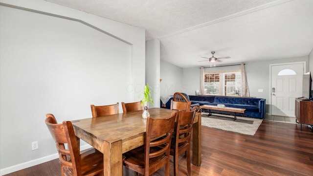 dining area with baseboards, a textured ceiling, a ceiling fan, and wood finished floors