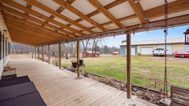 deck with an outdoor structure and a yard