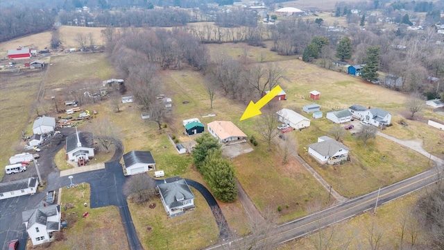 birds eye view of property with a rural view