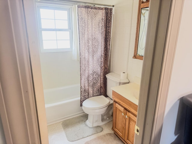 bathroom with vanity, tile patterned flooring, shower / bath combo with shower curtain, tile walls, and toilet