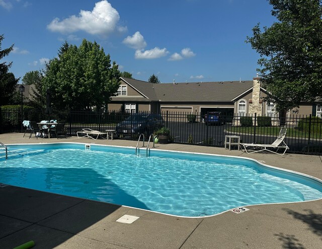 4163 Windbud Dr, New Albany, OH 43054 - community pool featuring a patio