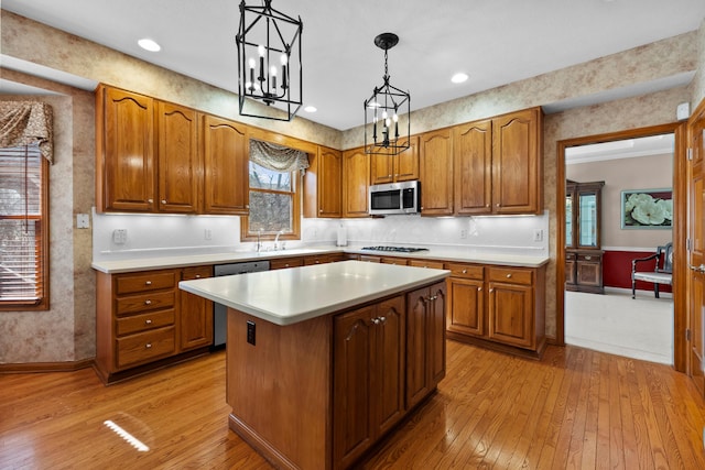 kitchen featuring stainless steel microwave, brown cabinets, and dishwasher