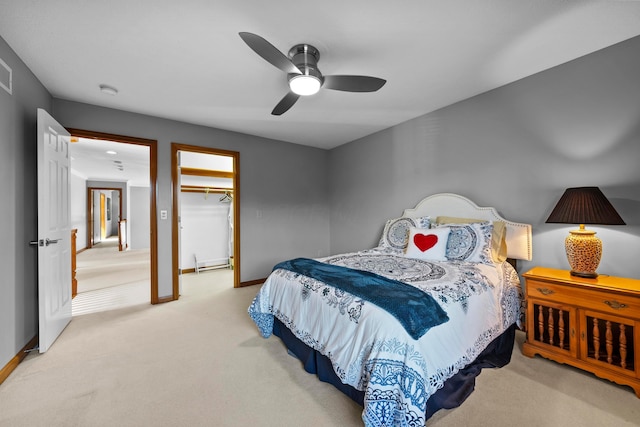 bedroom featuring a closet, baseboards, carpet, and ceiling fan