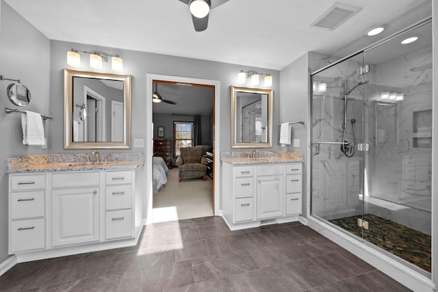 ensuite bathroom featuring visible vents, a marble finish shower, connected bathroom, ceiling fan, and vanity