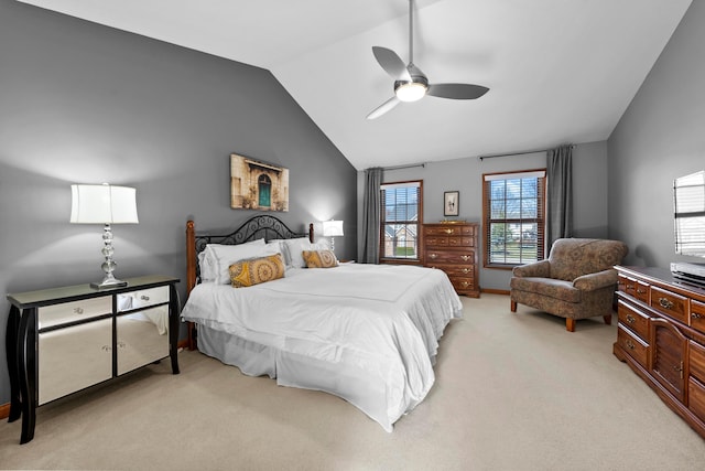 bedroom featuring light carpet, lofted ceiling, and a ceiling fan