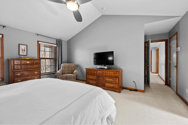 bedroom featuring a ceiling fan, lofted ceiling, light colored carpet, and baseboards