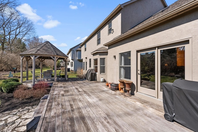 wooden terrace featuring a gazebo and grilling area