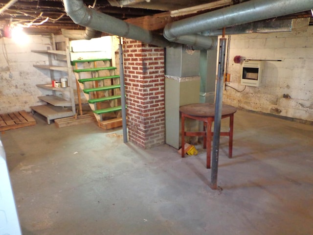 unfinished below grade area featuring heating unit