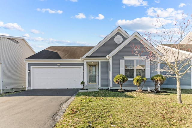 ranch-style house with aphalt driveway, a front lawn, and an attached garage