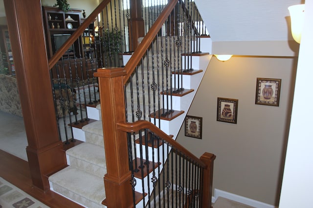 6884 Ballantrae Pl, Dublin, OH 43016 - staircase featuring baseboards