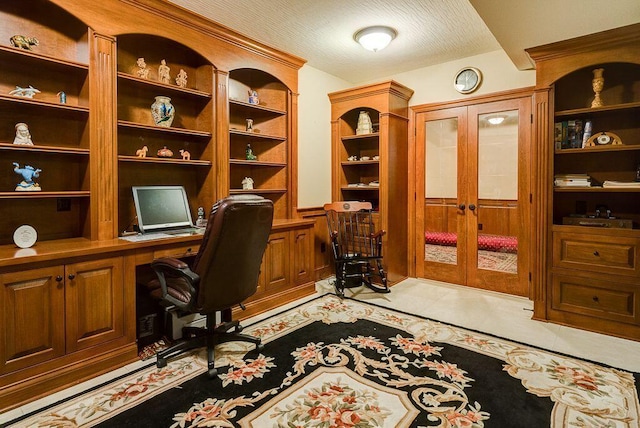 6884 Ballantrae Pl, Dublin, OH 43016 - office space with french doors, a textured ceiling, light tile patterned flooring, and built in study area