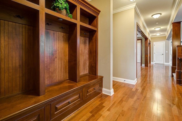 6884 Ballantrae Pl, Dublin, OH 43016 - mudroom with light wood-type flooring, baseboards, and ornamental molding