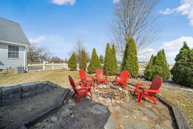 view of patio / terrace with cooling unit, fence, and an outdoor fire pit