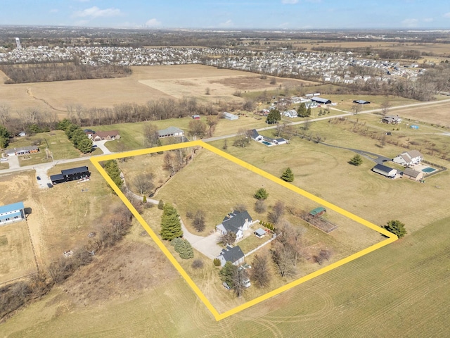 birds eye view of property featuring a rural view