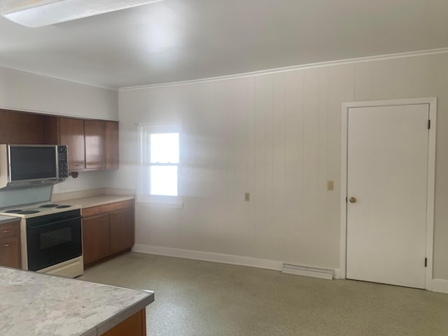 kitchen featuring baseboards, visible vents, ornamental molding, range with electric cooktop, and light countertops