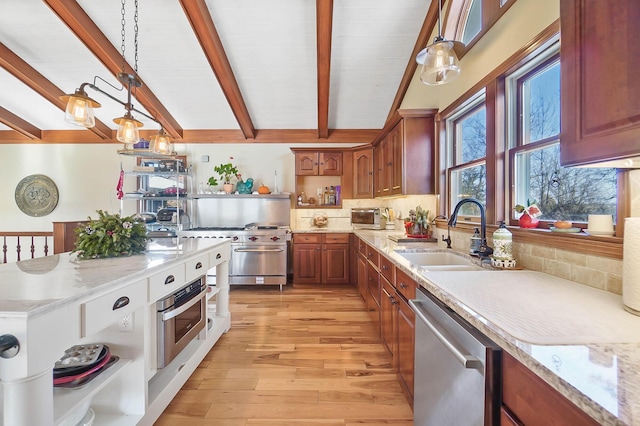 kitchen featuring light wood-style flooring, a sink, open shelves, tasteful backsplash, and appliances with stainless steel finishes