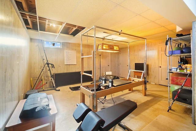 exercise room with wooden walls