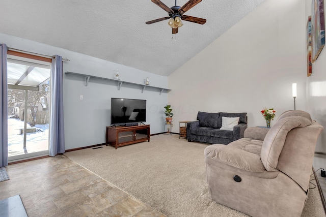 living room featuring baseboards, ceiling fan, light colored carpet, a textured ceiling, and high vaulted ceiling