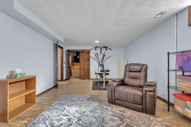 sitting room featuring visible vents and baseboards