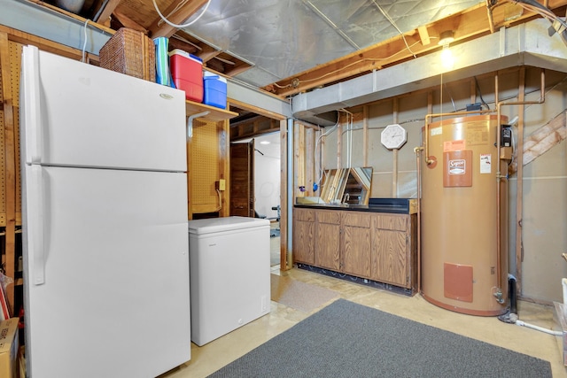 unfinished below grade area with refrigerator, water heater, and freestanding refrigerator