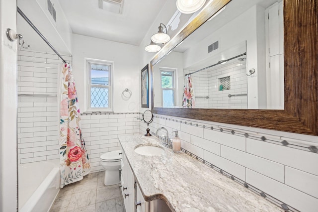 full bath featuring tile walls, visible vents, vanity, and toilet