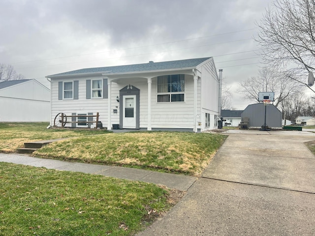 raised ranch with a front yard