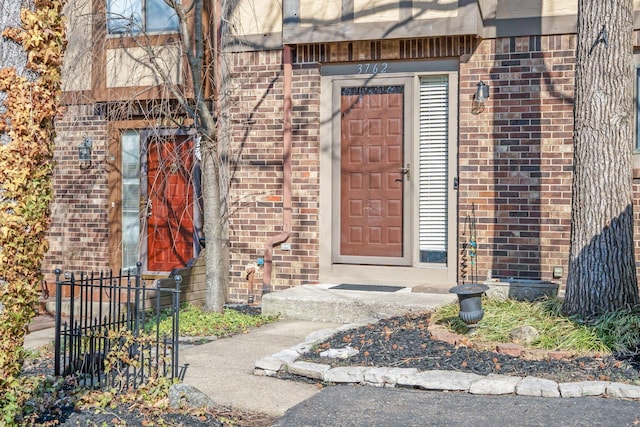 entrance to property with brick siding