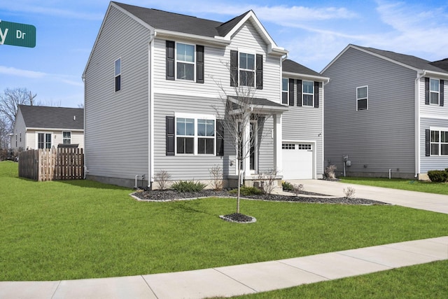 traditional home featuring an attached garage, concrete driveway, a front lawn, and fence