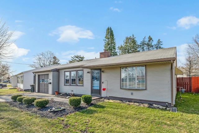 ranch-style home with a garage, a chimney, a front lawn, and fence