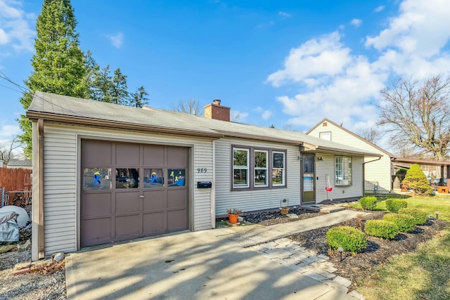 single story home featuring a chimney, an attached garage, concrete driveway, and fence