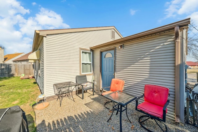 back of house with a patio area, a yard, and fence