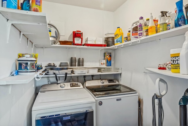 washroom featuring laundry area and washing machine and clothes dryer