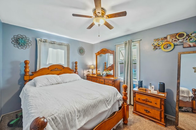 carpeted bedroom with a ceiling fan