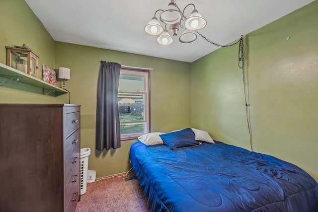 carpeted bedroom featuring an inviting chandelier