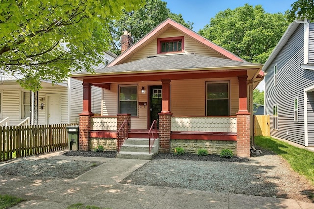 51 Hayden Ave, Columbus, OH 43222 - bungalow with covered porch, a shingled roof, and a chimney