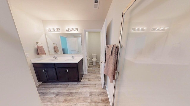 45 Genoa Cir, Commercial Point, OH 43116 - bathroom featuring double vanity, toilet, and a shower with shower door