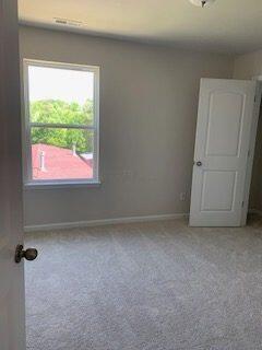 45 Genoa Cir, Commercial Point, OH 43116 - carpeted empty room with baseboards