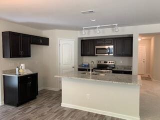 45 Genoa Cir, Commercial Point, OH 43116 - kitchen featuring stainless steel appliances, baseboards, track lighting, and a sink