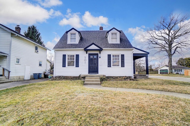 view of front of house with an attached carport, a shingled roof, a front lawn, a chimney, and driveway