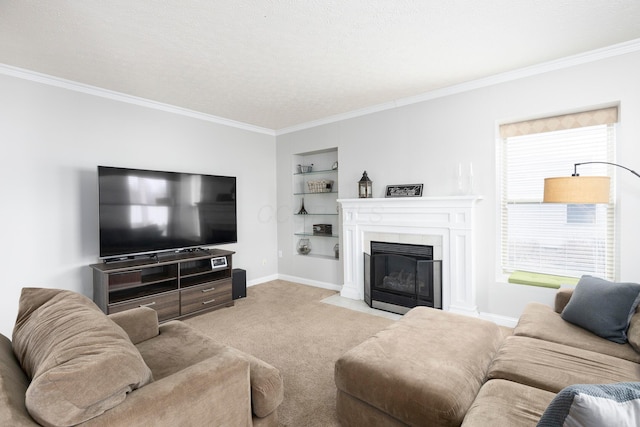 carpeted living room featuring built in features, a fireplace with flush hearth, baseboards, and crown molding