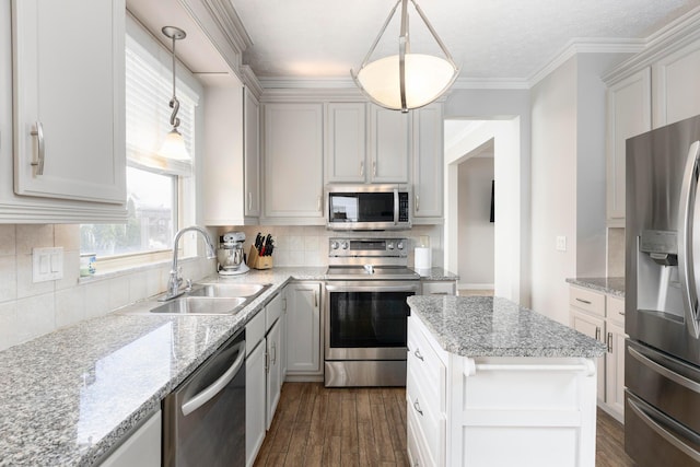 kitchen with dark wood-type flooring, a sink, backsplash, and appliances with stainless steel finishes